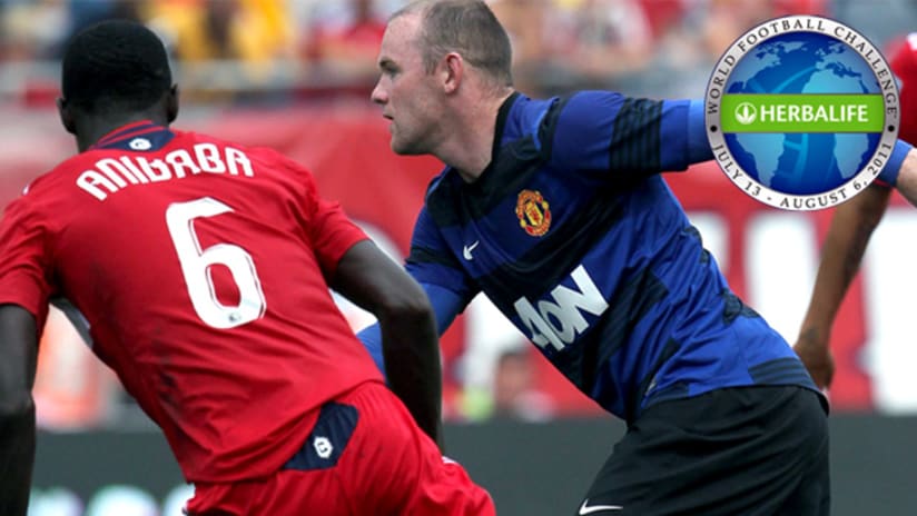 Manchester United's Wayne Rooney blazes past Chicago's Jalil Anibaba