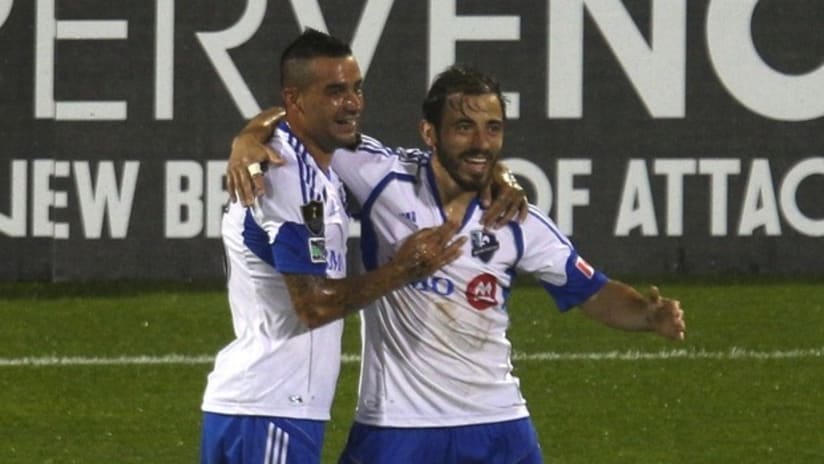 Hernan Bernardello celebrates Montreal's CCL goal with Andres Romero