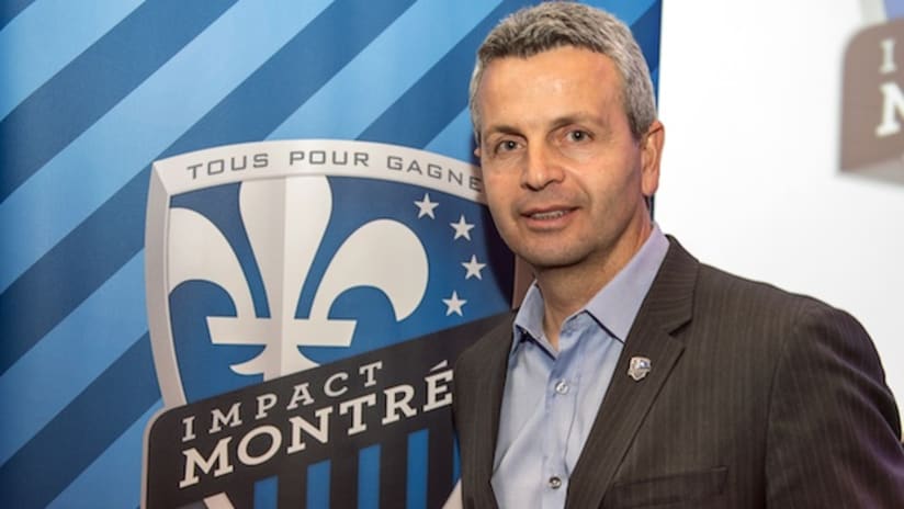 Klopas with Montreal logo