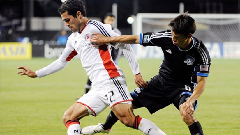 New England's Benny Feilhaber is challenged by San Jose's Shea Salinas