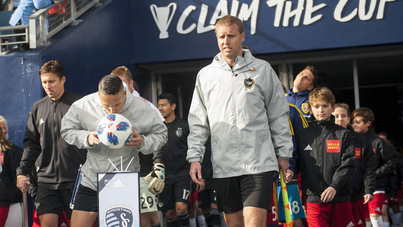Referees enter field before SKC-RSL