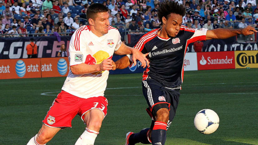 New York's Kenny Cooper chases New England's Kevin Alston, July 8, 2012.