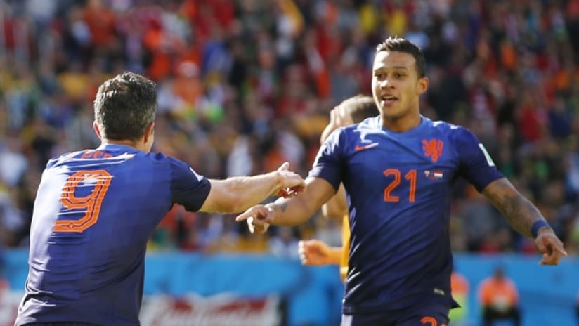 Memphis Depay is congratulated by Robin van Persie after scoring the third Dutch goal