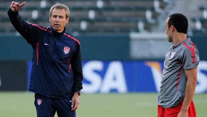 Jurgen Klinsmann makes a point to Landon Donovan in training, August 31, 2011.