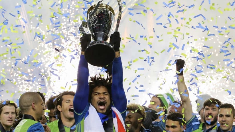 Roman Torres - MLS Cup - lifting trophy - Seattle Sounders - confetti