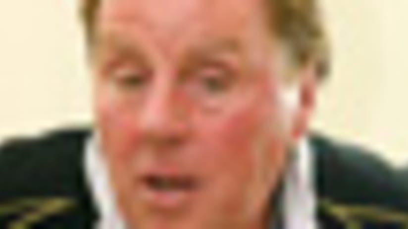 Harry Redknapp was in Germany when his wife called to say their house was raided by City of London police.
