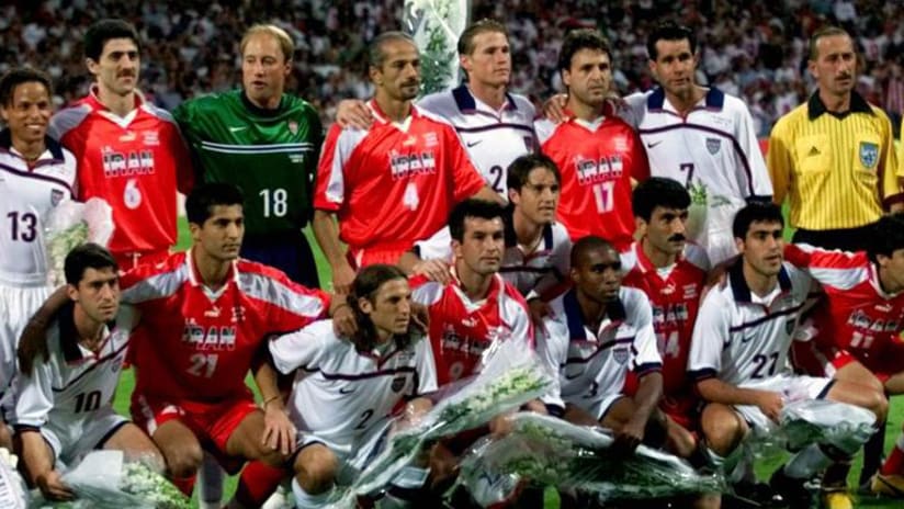 Players from Iran and the US national team pose for a joint team photo at the 1998 World Cup