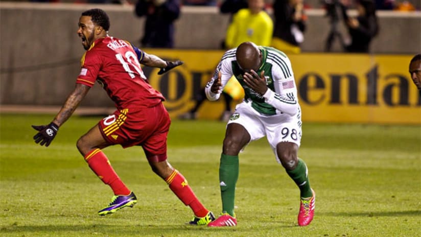 RSL's Robbie Findley celebrates while Portland's Futty Danso despairs