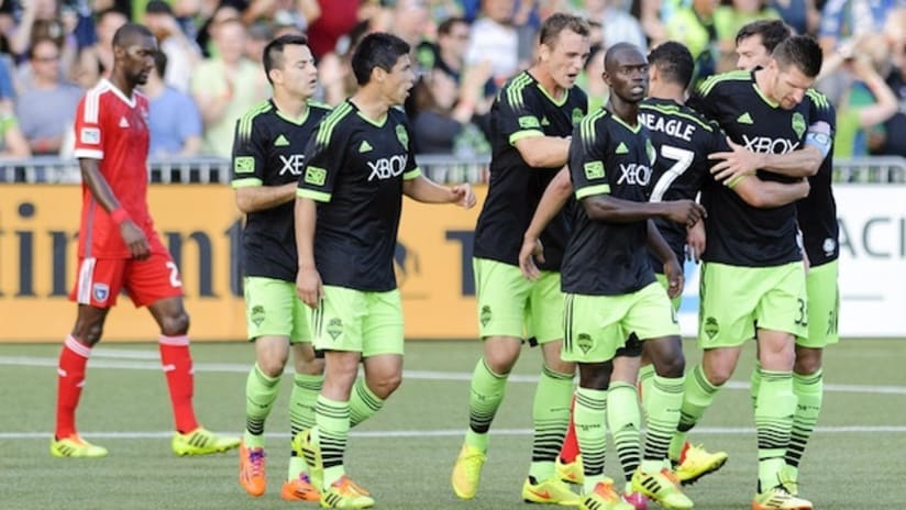 The Seattle Sounders celebrate a goal against the San Jose Earthquakes in the Open Cup