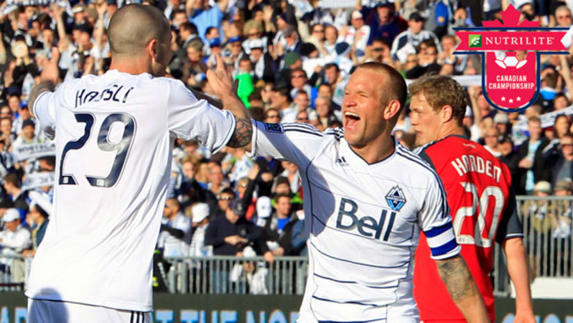 Vancouver's Jay DeMerit (right) and Eric Hassli are expected back in the Whitecaps' lineup against Toronto FC on Wednesday.