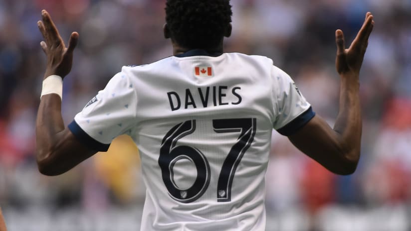 Alphonso Davies -- Back -- Hands pointing up