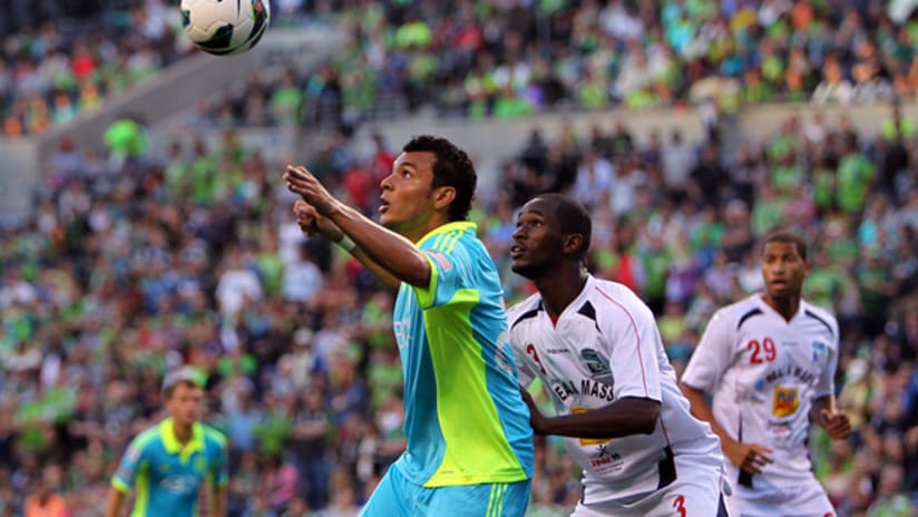 Seattle's Sammy Ochoa receives the ball with a Caledonia defender on him