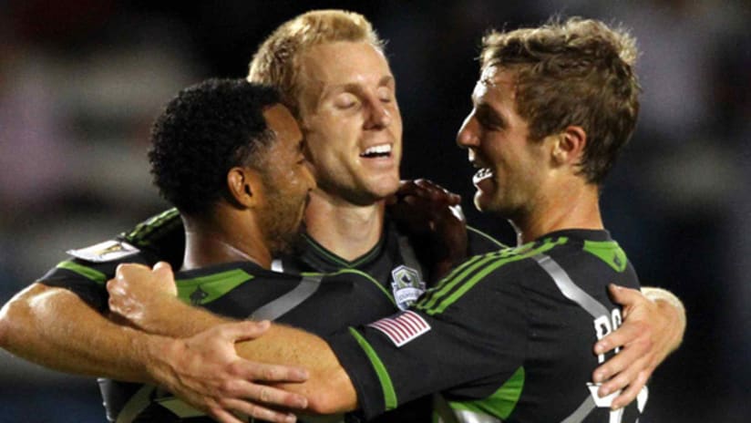 Members of the Seattle Sounders celebrate their 1-0 win over Monterrey on Tuesday night.