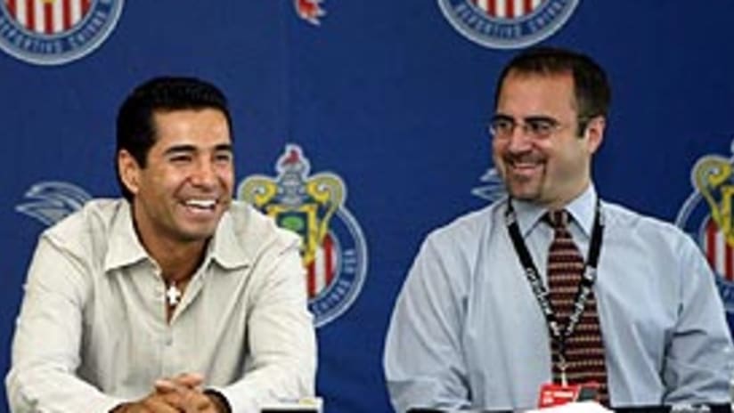 Chivas USA GM Whit Haskel (right) is happy that Martin Zuniga is staying with the club.