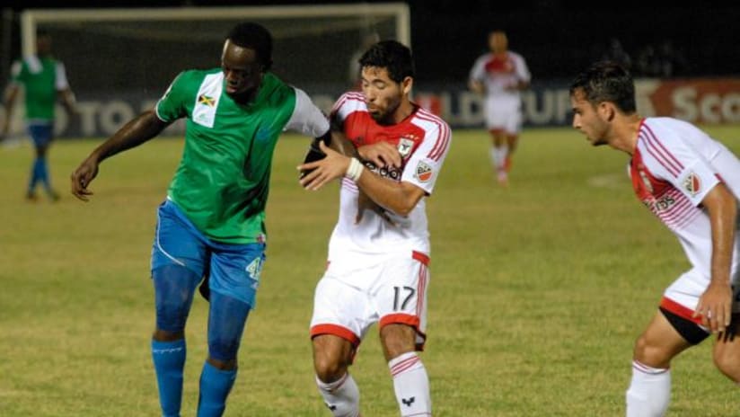 DC United's Miguel Aguilar battles Montego Bay player in CCL action