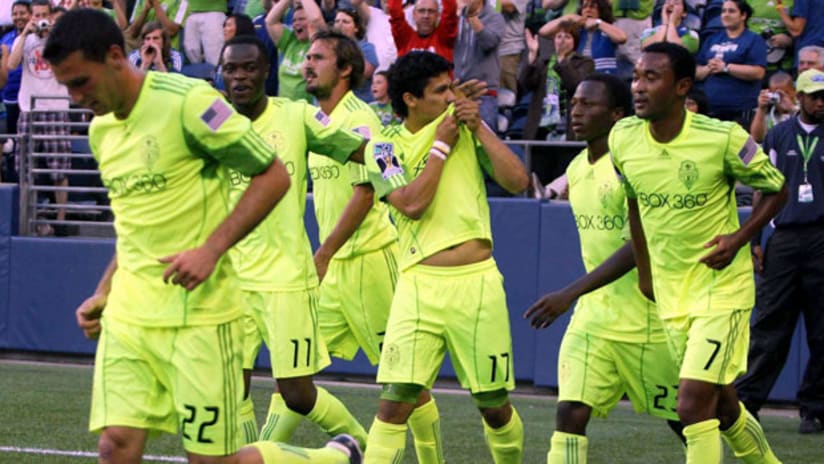 Fredy Montero and the Sounders celebrate.
