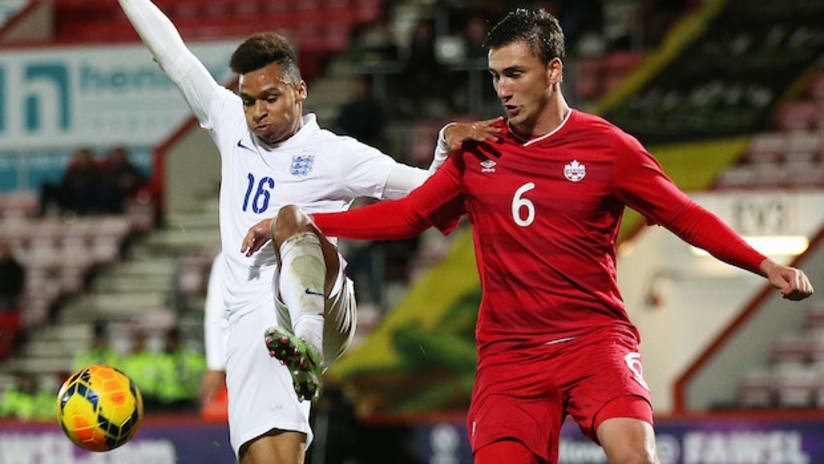 Luca Gasparotto (right) in action for the Canada U-20s against England