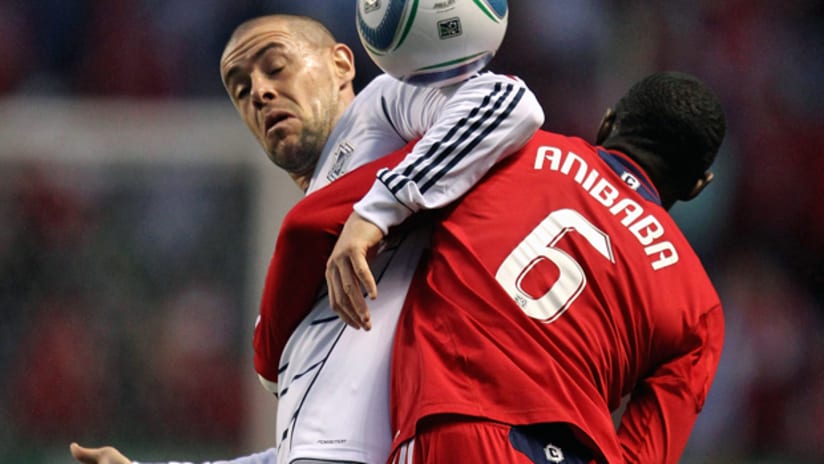 Jalil Anibaba (Chicago Fire) and Eric Hassli (Vancouver Whitecaps)