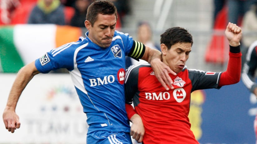 Montreal's Davy Arnaud challenges Toronto's Eric Avila (Oct. 20, 2012)