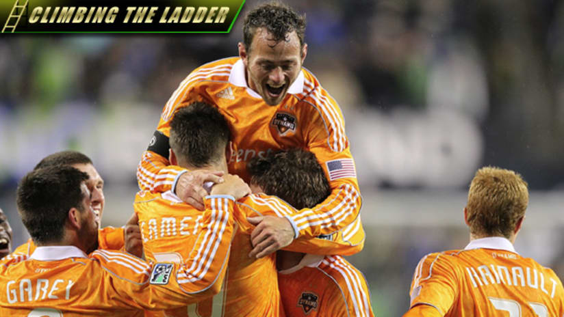 Brad Davis (center) led the league in total assists in 2011