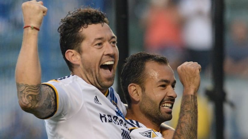 Dan Gargan and Juninho celebrate a goal for the LA Galaxy