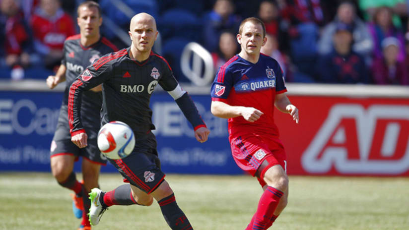 Michael Bradley of Toronto FC TFC and Harry Shipp of Chicago Fire