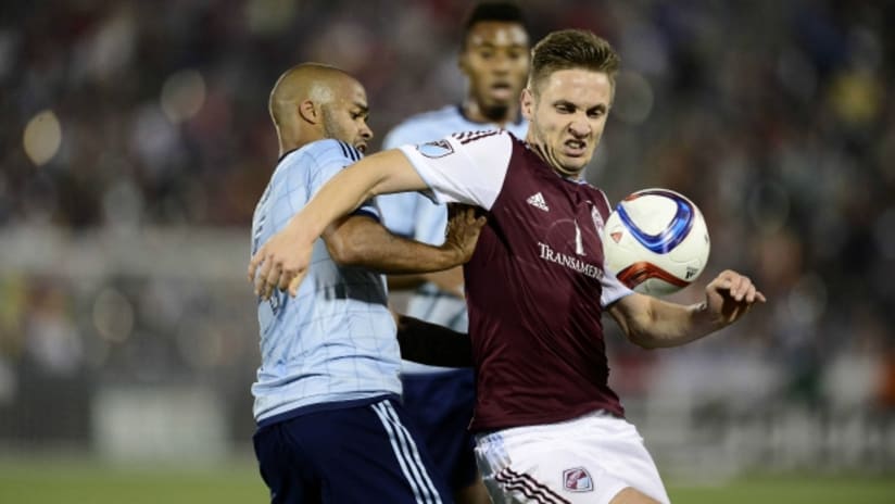 Kevin Doyle (Colorado Rapids) fights to control the ball against Sporting Kansas City
