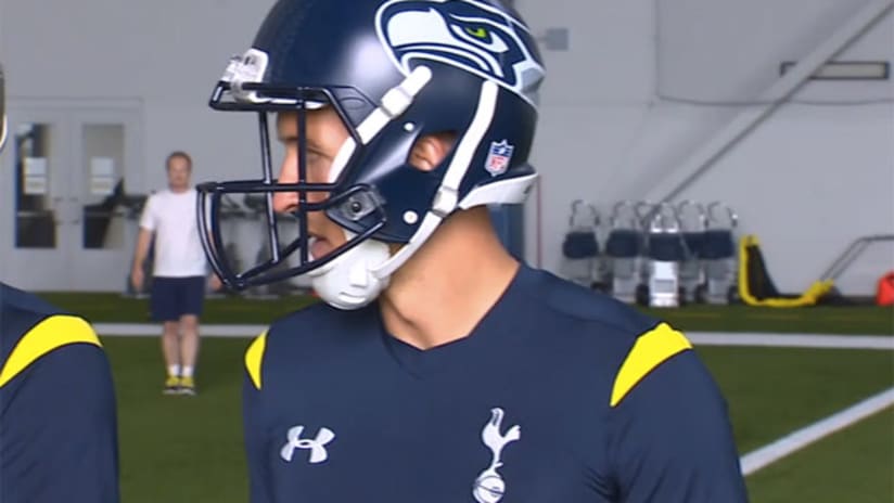Tottenham Hotspur player wearing an NFL helmet
