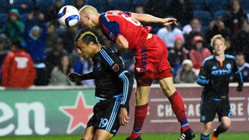 Eric Gehrig (Chicago Fire) rises above Khiry Shelton (NYCFC) on a header