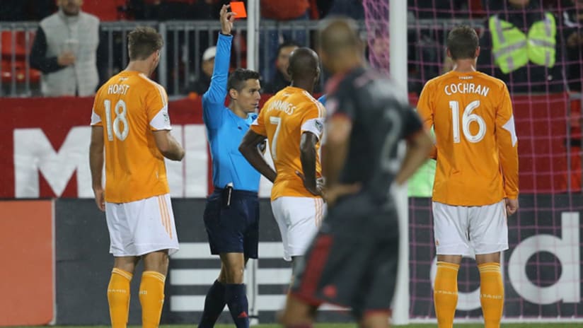 Houston Dynamo defender AJ Cochran is shown red by Armando Villarreal