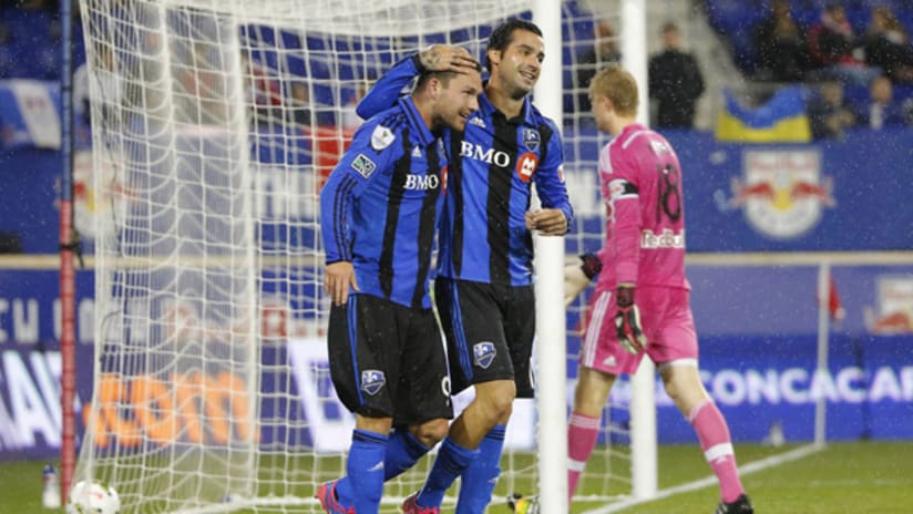 Jack McInerney and Andres Romero celebrate a goal for the Montreal Impact