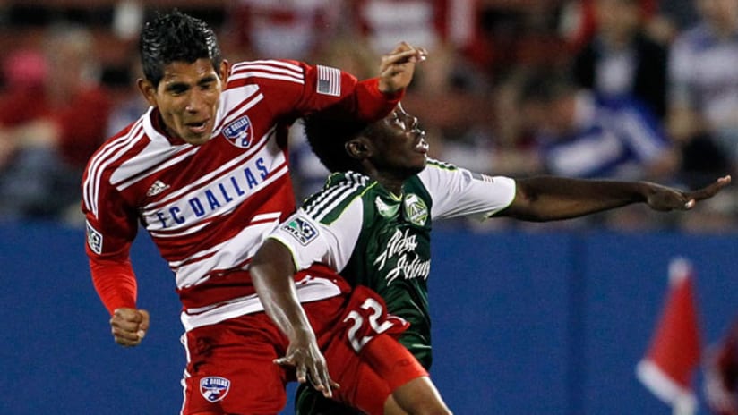 FC Dallas' Carlos Rodriguez clashes with Portland's Kalif Alhassan