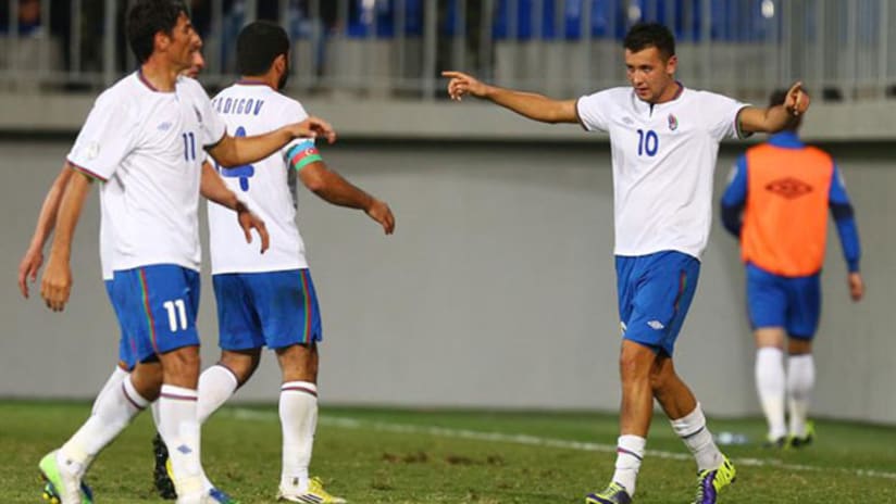 Azerbaijan forward Rufat Dadashov celebrates a goal.