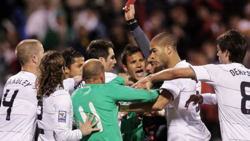 USA-Mexico: Oguchi Onyewu and others challenge Mexican players after red card to Rafa Marquez.