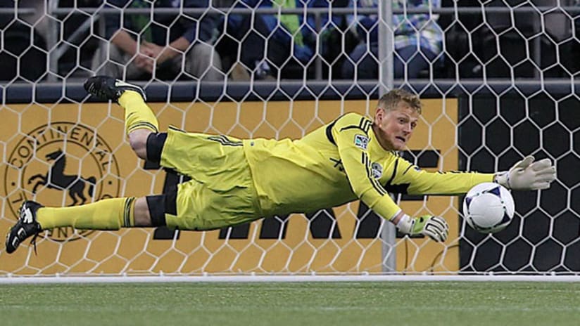 Seattle's Bryan Meredith dives to make a save