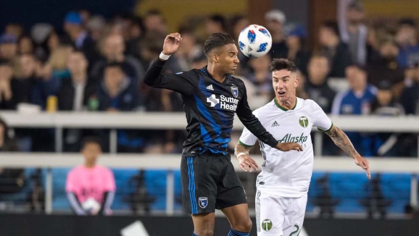Danny Hoesen and Liam Ridgewell battle for ball