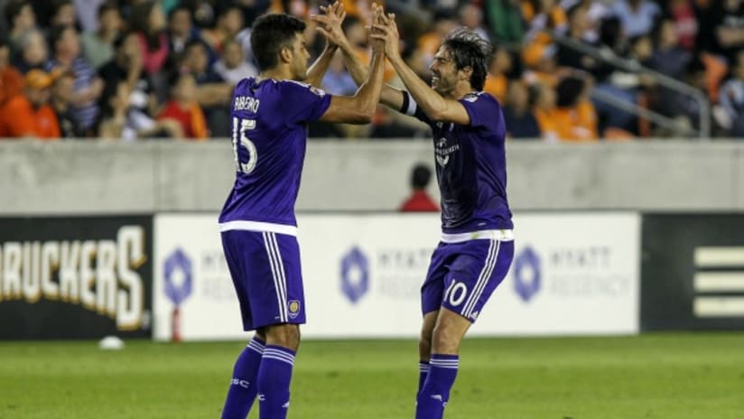 Orlando City SC's Pedro Ribeiro and Kaka celebrate goal