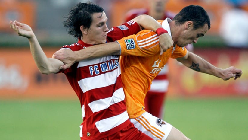 FCD's Zach Loyd and Houston's Cam Weaver fight for the ball.