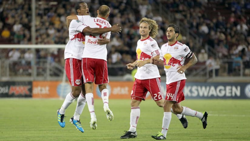 The New York Red Bulls celebrate Joel Lindpere's late equalizer.