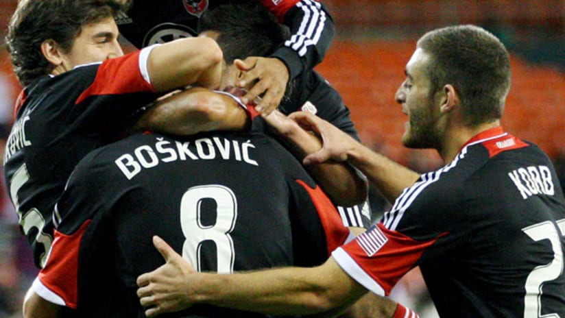 D.C.'s Branko Boskovic celebrates with his teammates after scoring vs. Chivas USA