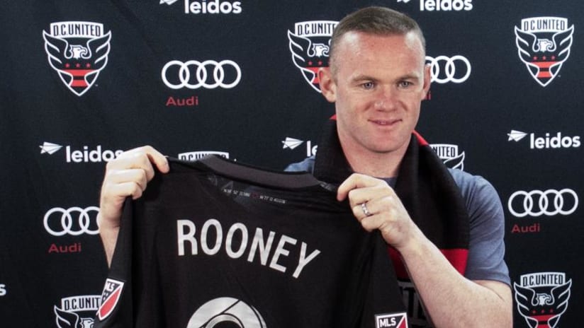 Wayne Rooney - holds up his D.C. United jersey