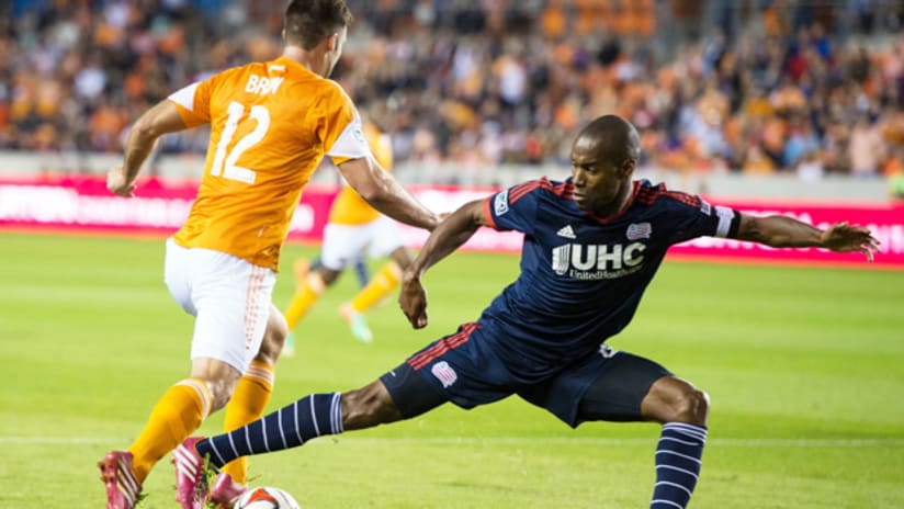 Jose Goncalves attempts to stop Houston Dynamo forward Will Bruin (March 8, 2014)