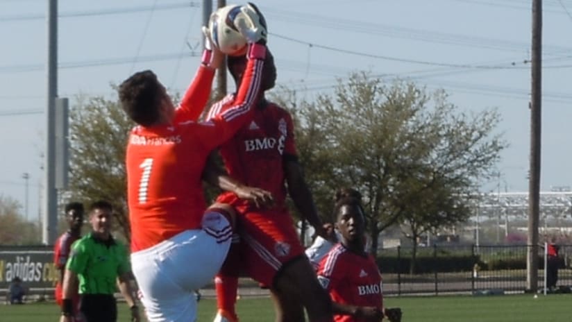 River Plate goalkeeper Ezequiel Muth challenges a Toronto attacker in Generation adidas Cup play