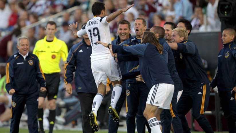 Juninho celebrates his goal vs. Colorado with the Galaxy bench.