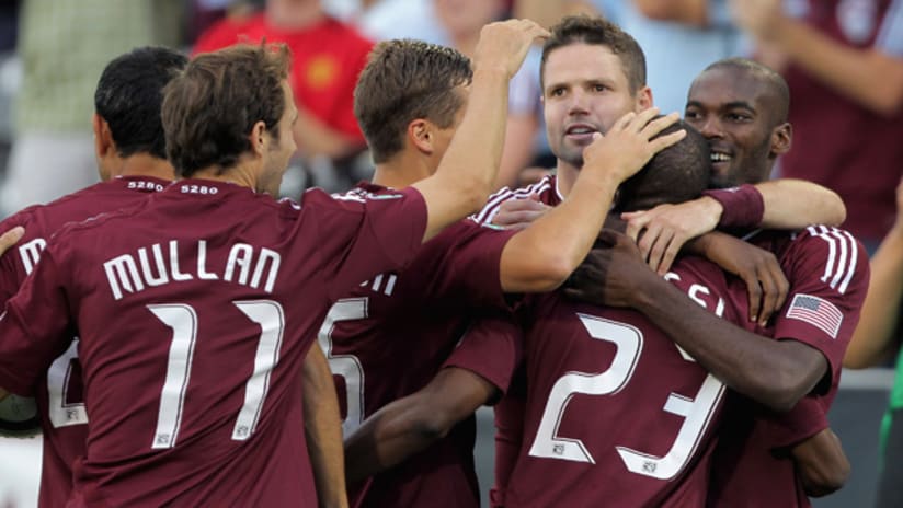Members of the Colorado Rapids congratulate Sanna Nyassi on his second goal of the game on Wednesday against New York.