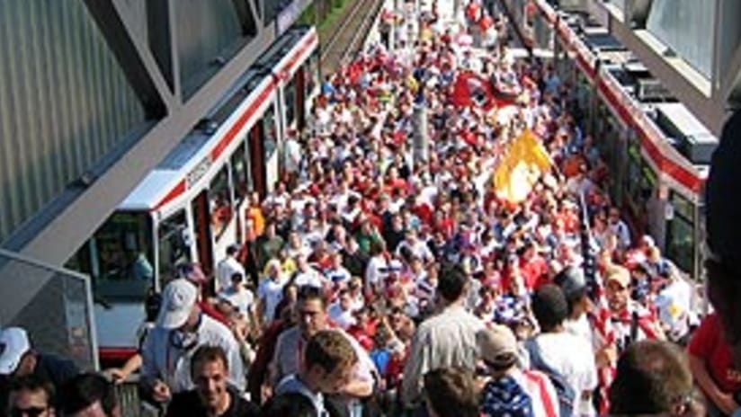 A horde of fans makes its way from the tram to the stadium in Gelsenkirchen.