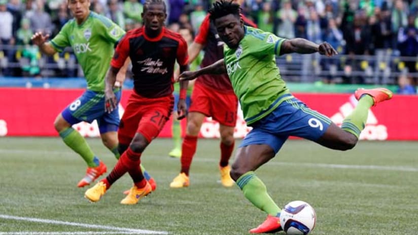 Obafemi Martins (Seattle Sounders) takes a shot in a game against the Portland Timbers