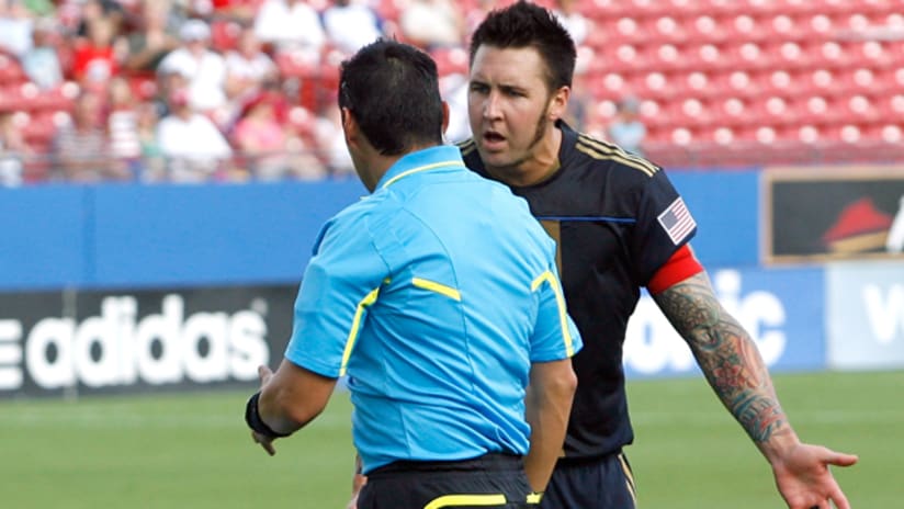 Union captain Danny Califf tries to reason with the referee following a PK call.
