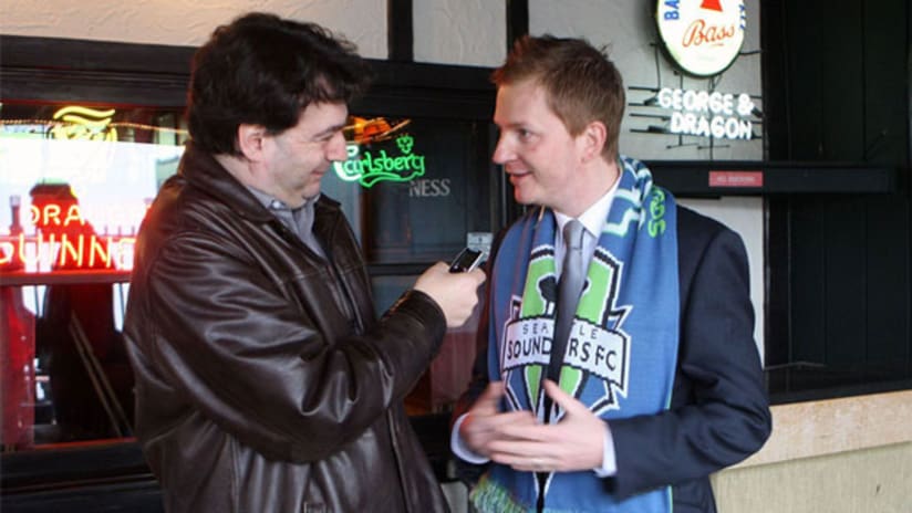 Seattle Sounders FC play-by-play commentator Arlo White (right) speaks with Seattle reporter Steve Clare.