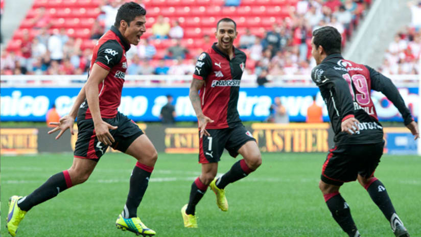 Edgar Castillo and his Atlas teammates celebrate a goal against Chivas